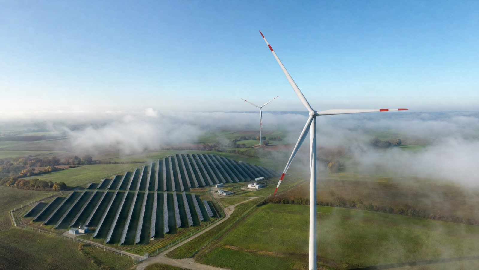 Wind farm and ground-mounted solar plant from the air